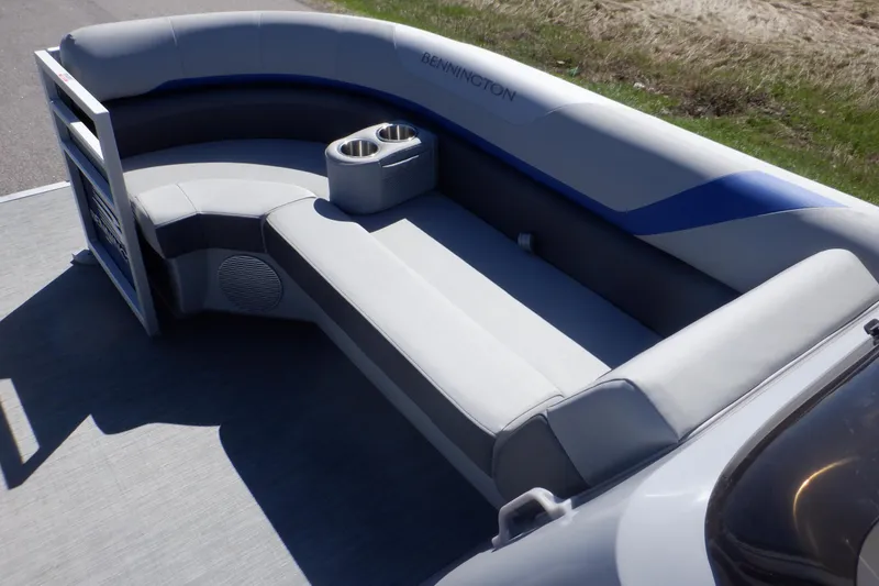 Slide: The Image of 2022 Bennington SX 22 Swingback boat interior with gray seating and cup holders. - 17