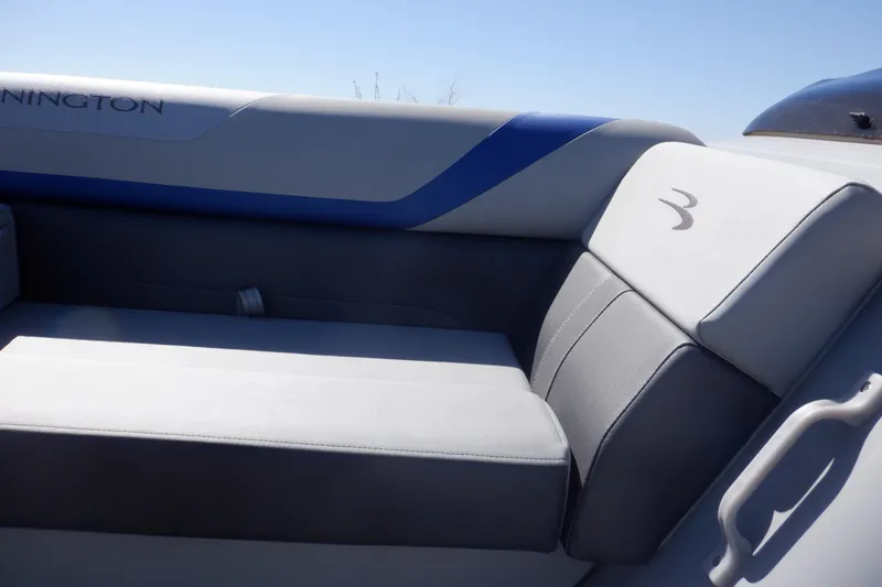 Slide: The Image of 2022 Bennington SX 22 Swingback boat interior with gray and blue seating. - 19