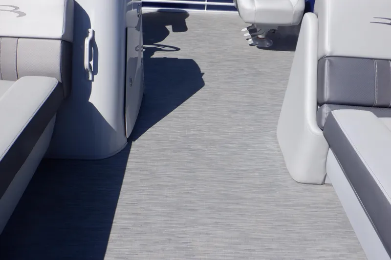 Slide: The Image of 2022 Bennington SX 22 Swingback interior with gray seating and flooring. - 22