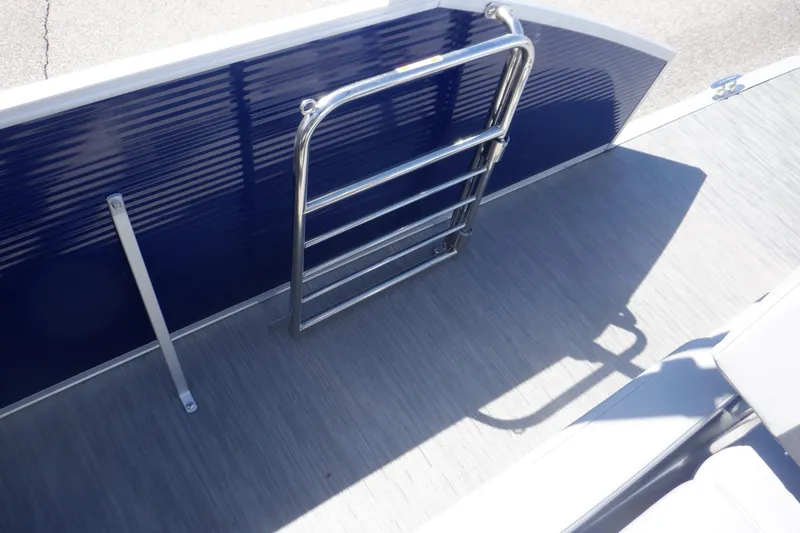 Slide: The Image of 2022 Bennington SX 22 Swingback boat ladder and deck area. - 27