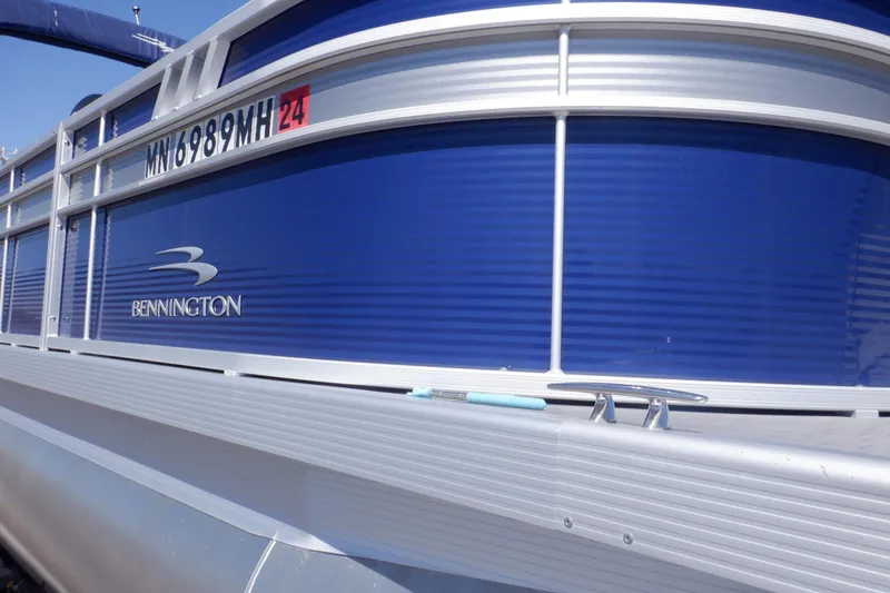 Slide: The Image of 2022 Bennington SX 22 Swingback pontoon boat with blue exterior and registration number. - 39