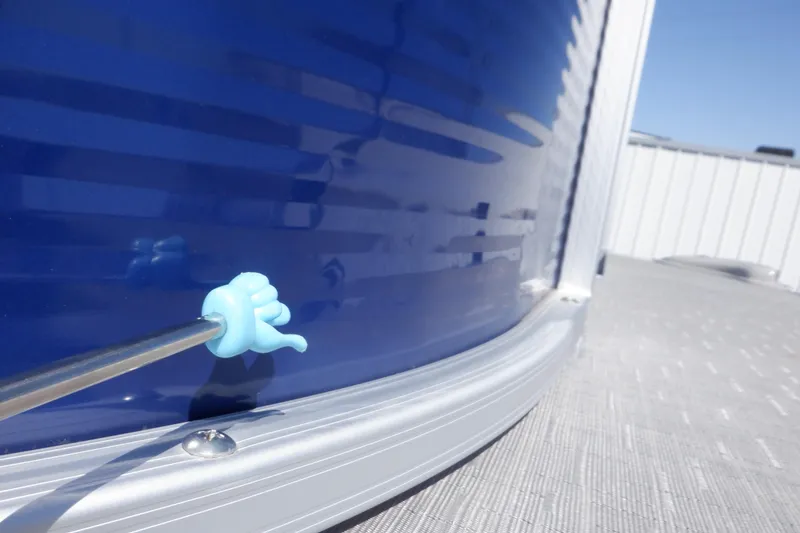 Slide: The Image of 2022 Bennington SX 22 Swingback boat detail with blue panel and metal railing. - 40