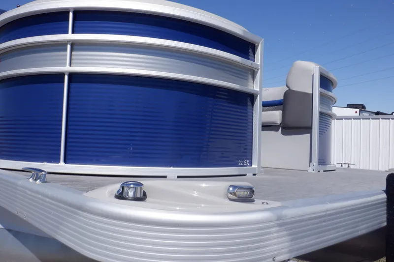 Slide: The Image of 2022 Bennington SX 22 Swingback pontoon boat with blue and silver exterior detailing. - 41