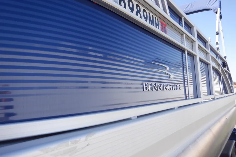 Slide: The Image of 2022 Bennington SX 22 Swingback pontoon boat with sleek blue exterior design. - 45