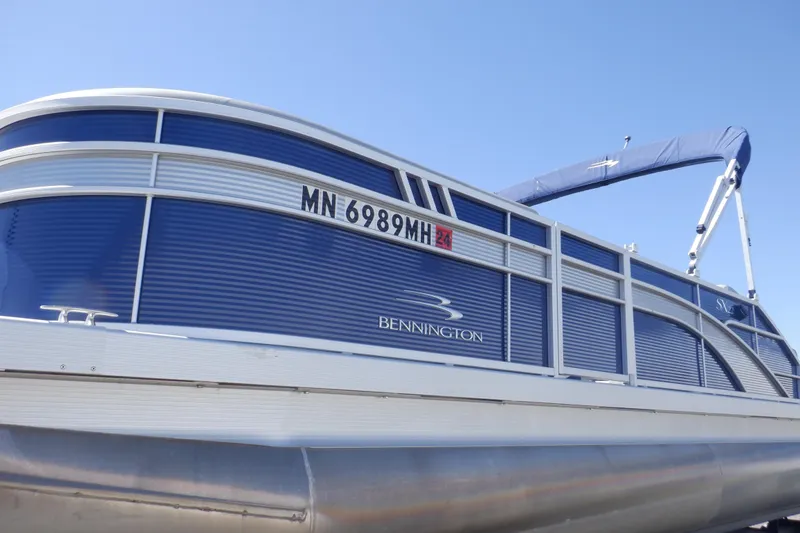 Slide: The Image of 2022 Bennington SX 22 Swingback pontoon boat with blue exterior and registration number MN 6989MH. - 8