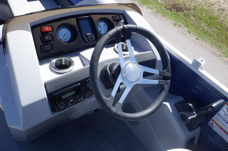 Slide: The Image of 2022 Bennington SX 22 Swingback boat dashboard with steering wheel and gauges. - 9