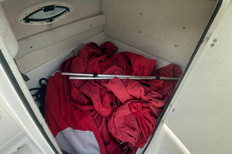 Slide: The Image of 2004 Monterey 253 Explorer Sport cabin with red fabric and metal rod. - 10