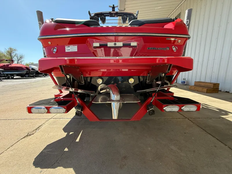 Slide: The Image of Red 2021 Supra SL boat rear view, showcasing sleek design and powerful features. - 7