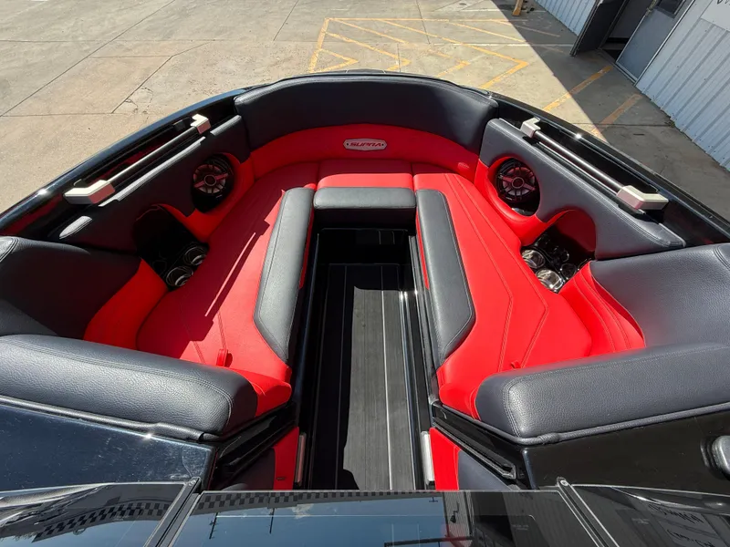 Slide: The Image of 2021 Supra SL boat interior with red and black seating, featuring premium audio speakers. - 9