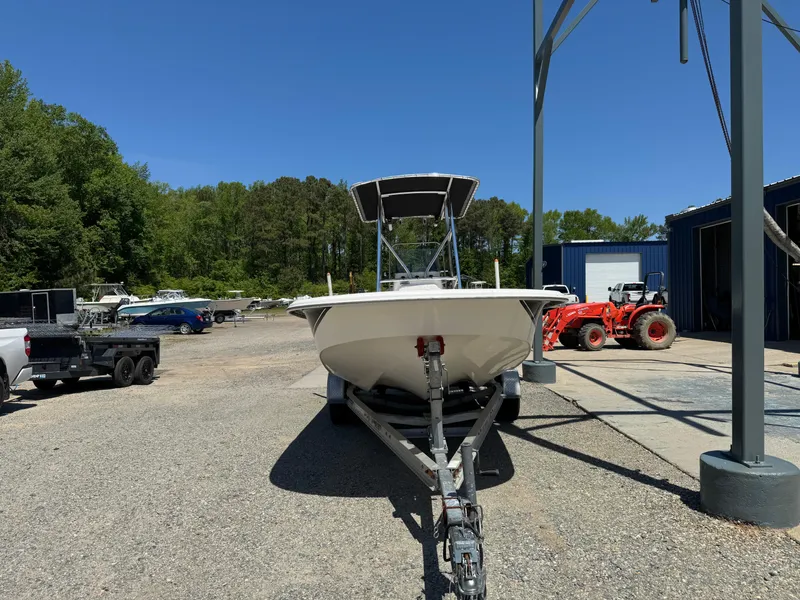 Slide: The Image of 2010 Carolina Skiff 218 DLV Elite boat on trailer in outdoor storage area. - 1