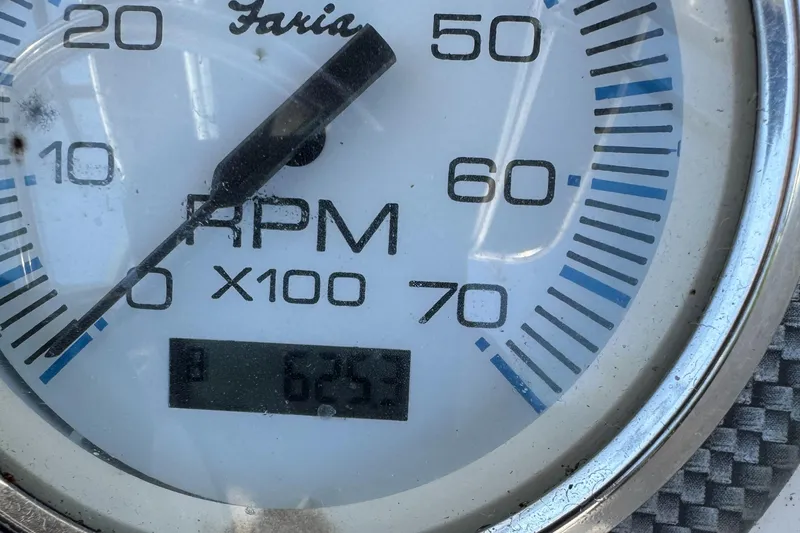 Slide: The Image of Close-up of a Faria RPM gauge on a 2010 Carolina Skiff 218 DLV Elite boat. - 11