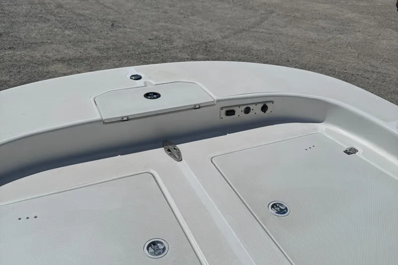 Slide: The Image of 2010 Carolina Skiff 218 DLV Elite boat deck with storage compartments. - 7