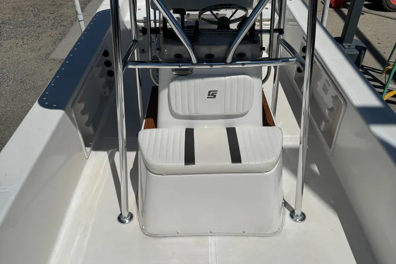 Slide: The Image of 2010 Carolina Skiff 218 DLV Elite boat interior with console and seating. - 9