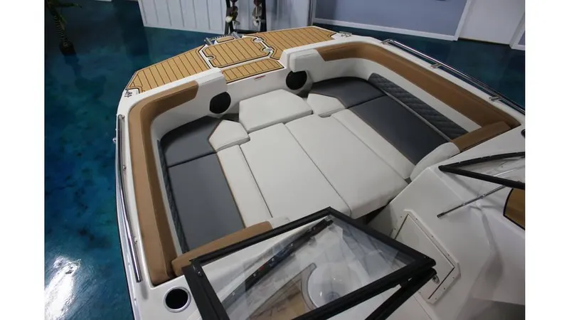 Slide: The Image of 2025 Starcraft SVX 190 OB DC boat interior with cushioned seating and modern design. - 4