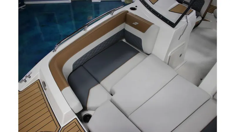 Slide: The Image of 2025 Starcraft SVX 190 OB DC boat interior with cushioned seating and modern design. - 9