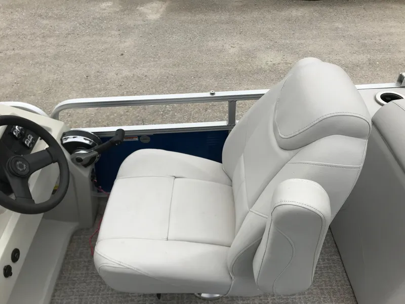 Slide: The Image of 2019 Avalon Venture Quad Lounge boat seat with steering wheel and controls. - 10