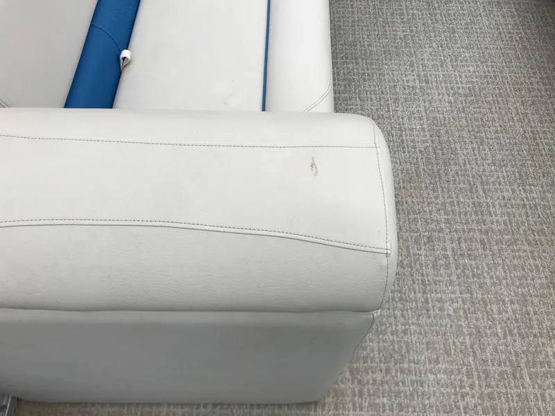 Slide: The Image of 2019 Avalon Venture Quad Lounge boat seat with light gray upholstery and blue accents. - 11