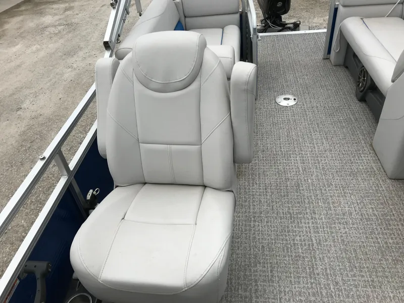Slide: The Image of 2019 Avalon Venture Quad Lounge boat interior with plush seating and carpeted flooring. - 15