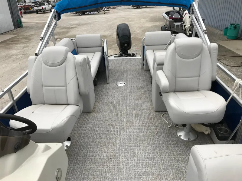 Slide: The Image of 2019 Avalon Venture Quad Lounge boat with spacious seating and modern design. - 19