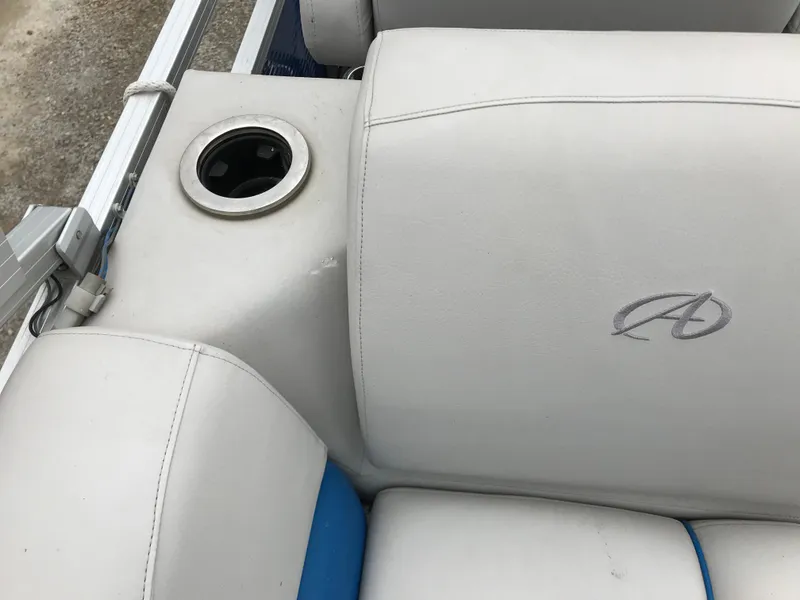 Slide: The Image of 2019 Avalon Venture Quad Lounge boat seat with cup holder and logo. - 21