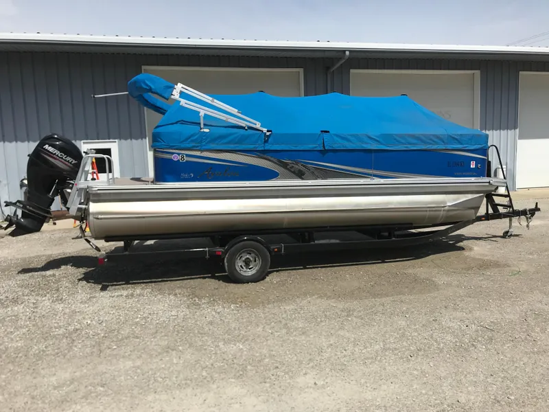 Slide: The Image of 2019 Avalon Venture Quad Lounge 20' pontoon boat with blue cover on trailer. - 4