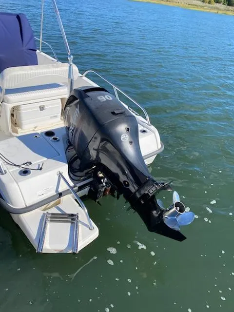 Slide: The Image of 2014 Boston Whaler 170 Dauntless boat with outboard motor on water. - 3
