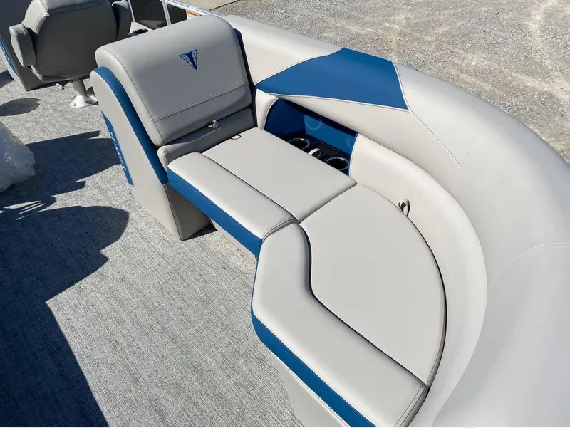 Slide: The Image of 2024 Trifecta 24 RF LE 2.75 boat interior with blue and gray seating. - 10