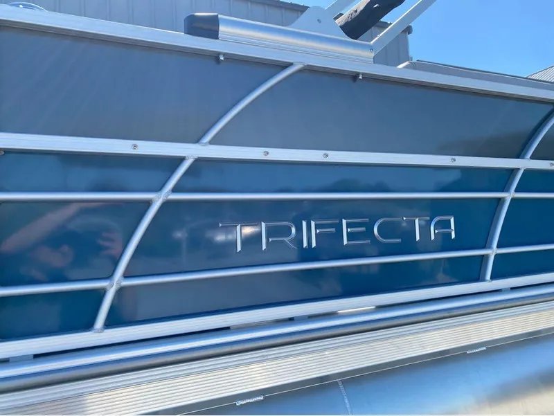 Slide: The Image of 2024 Trifecta 24 RF LE 2.75 pontoon boat side view with logo. - 11