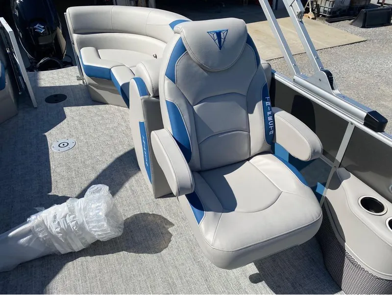 Slide: The Image of 2024 Trifecta 24 RF LE 2.75 boat interior with plush seating and modern design. - 3