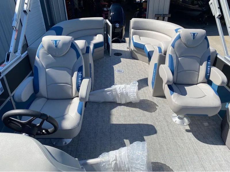 Slide: The Image of 2024 Trifecta 24 RF LE 2.75 pontoon boat interior with plush seating and modern design. - 4