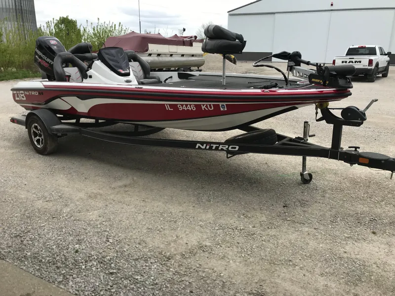 Slide: The Image of 2017 Nitro Z18 boat on trailer in outdoor setting. - 26
