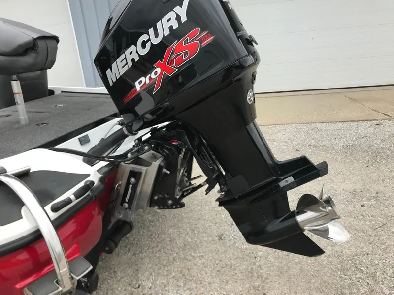 Slide: The Image of 2017 Nitro Z18 boat with Mercury Pro XS outboard motor, parked on concrete. - 3