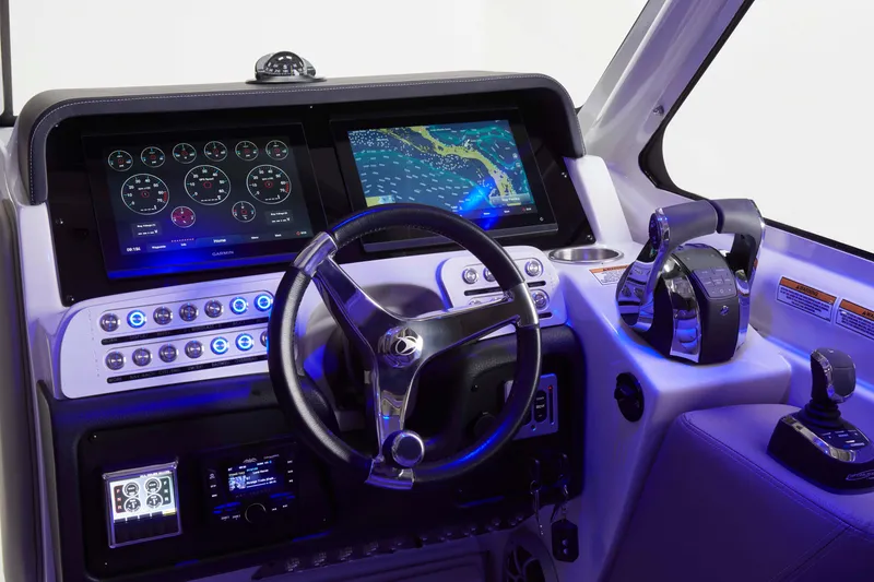 Slide: The Image of Cockpit of 2025 Finseeker 260 DC boat with advanced navigation and control systems. - 10