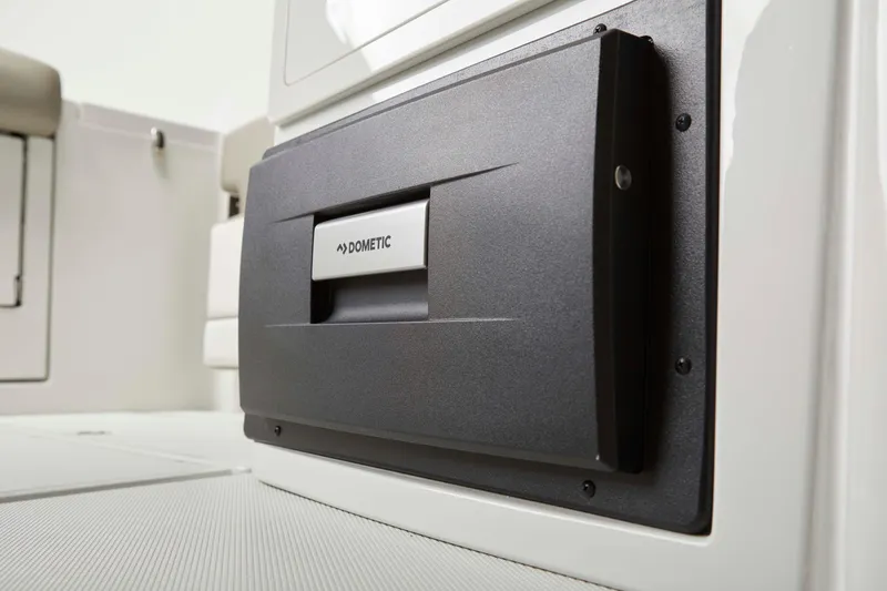 Slide: The Image of 2025 Finseeker 260 DC boat interior with Dometic appliance detail. - 12
