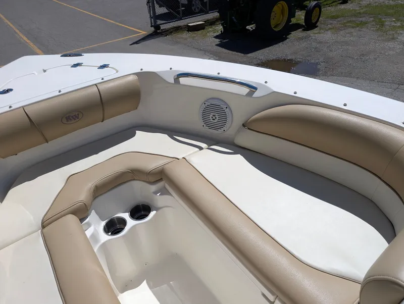 Slide: The Image of 2017 Key West 203 DFS boat interior with beige seating and cup holders. - 10