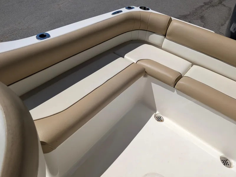 Slide: The Image of 2017 Key West 203 DFS boat interior with beige seating and cup holders. - 11
