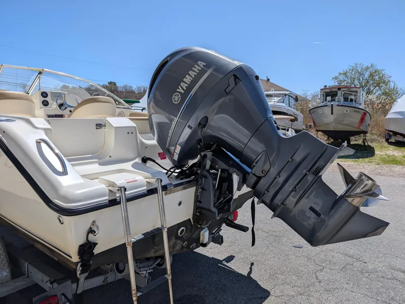 Slide: The Image of 2017 Key West 203 DFS boat with Yamaha outboard motor, parked outdoors. - 18