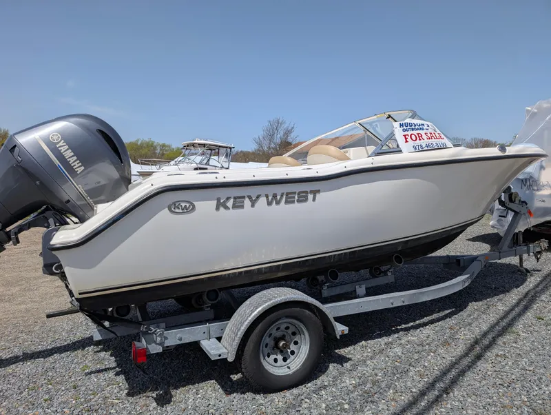 Slide: The Image of 2017 Key West 203 DFS boat on trailer, for sale sign visible. - 3