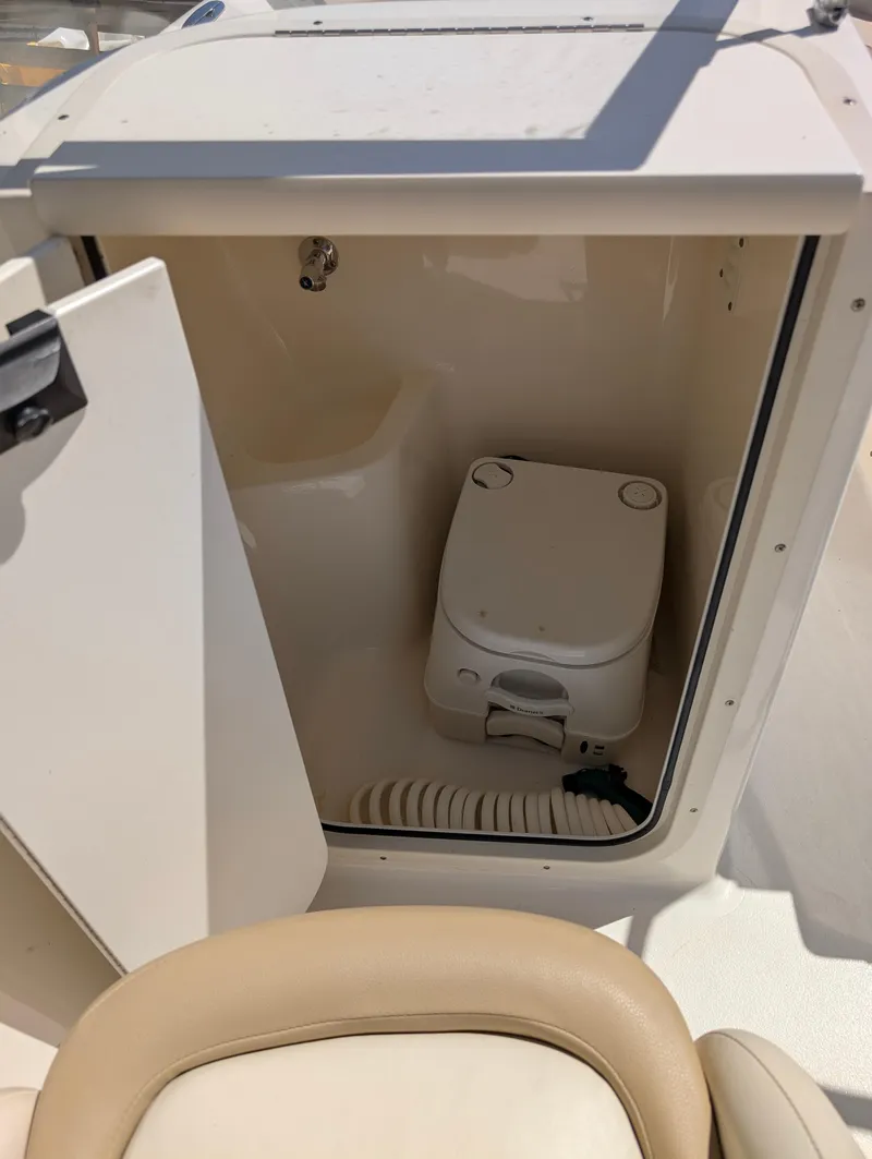 Slide: The Image of 2017 Key West 203 DFS boat interior with compact marine toilet. - 4