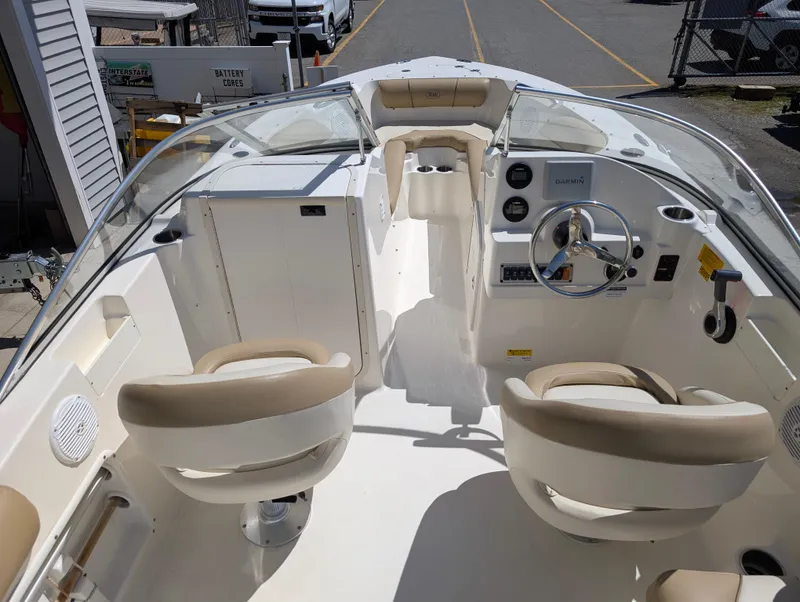 Slide: The Image of 2017 Key West 203 DFS boat interior with dual seats and steering console. - 7
