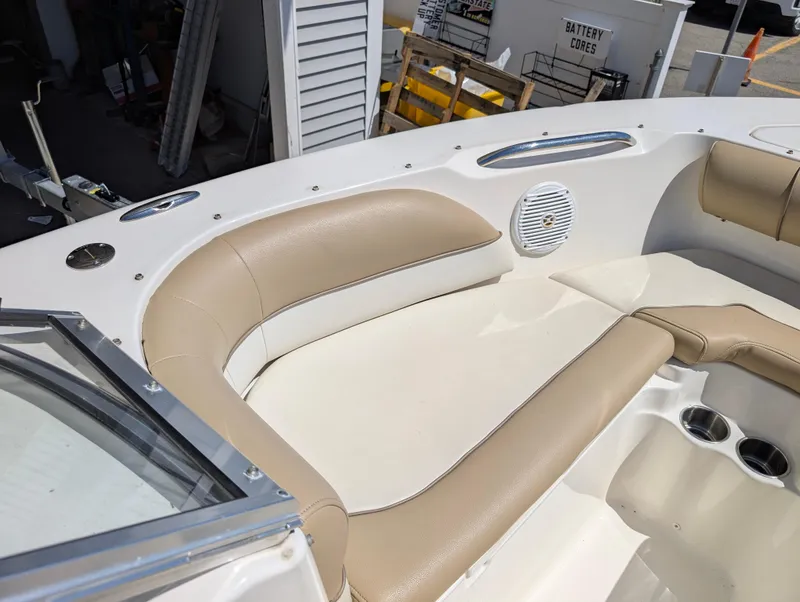 Slide: The Image of 2017 Key West 203 DFS boat interior with beige seating and cup holders. - 9