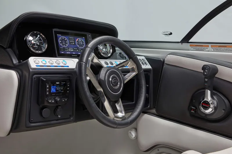 Slide: The Image of 2025 Crownline 260 XSS boat dashboard with modern controls and steering wheel. - 11