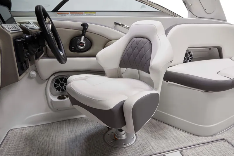 Slide: The Image of 2025 Crownline 290 XSS boat interior with modern helm and luxurious seating. - 2