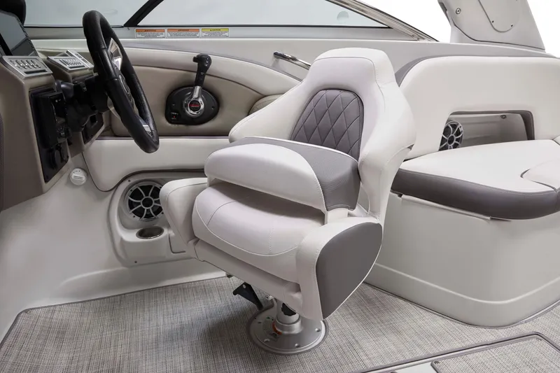 Slide: The Image of 2025 Crownline 290 XSS boat interior with plush seating and modern dashboard. - 3