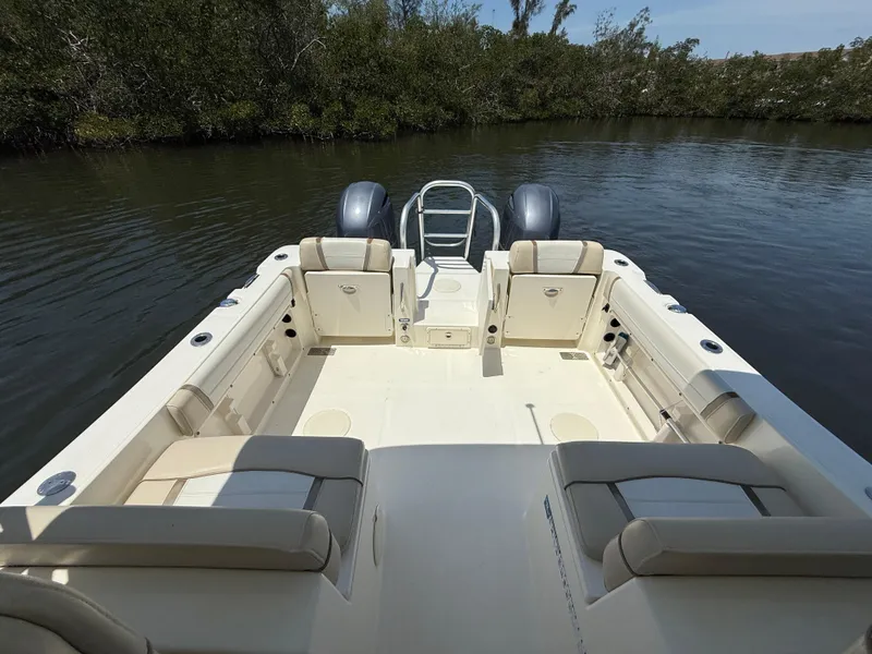 Slide: The Image of 2015 World Cat 255 DC boat with spacious seating on calm water. - 10