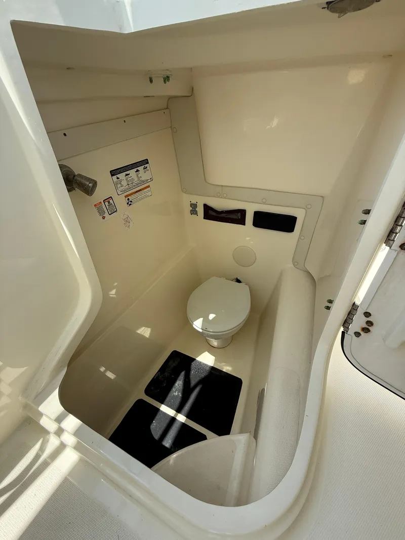 Slide: The Image of 2015 World Cat 255 DC boat interior with compact marine toilet. - 17