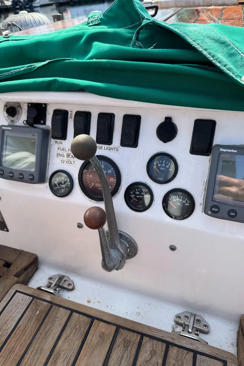 Slide: The Image of 1988 Custom Aft Cockpit boat dashboard with gauges and controls. - 29