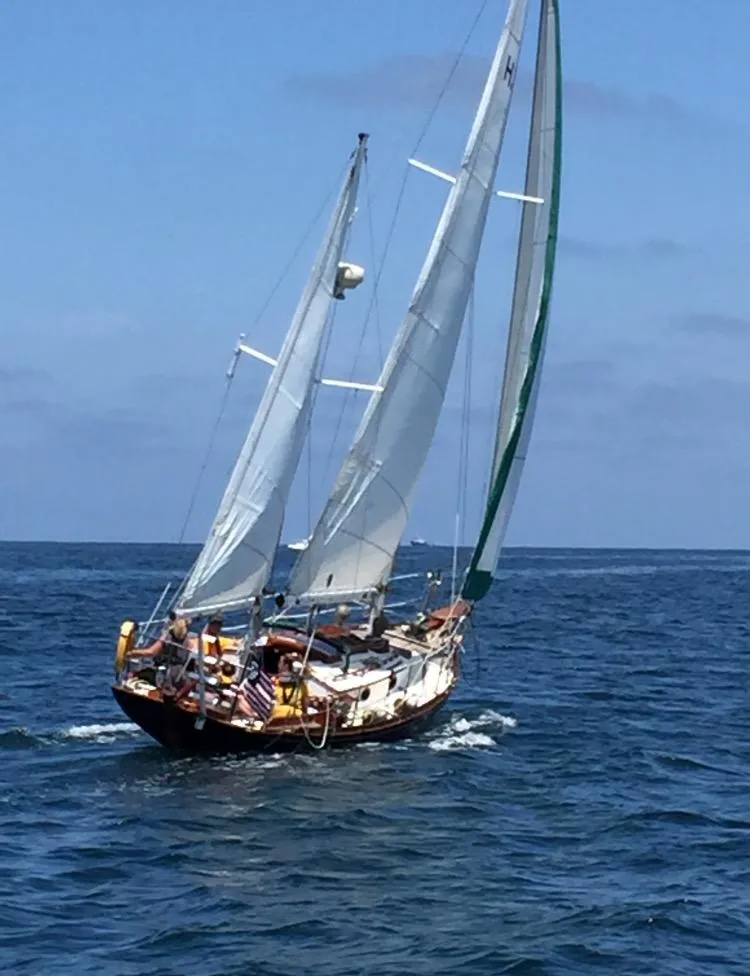Slide: The Image of Sailing yacht "Custom Aft Cockpit" 1988 navigating open sea under clear skies. - 3