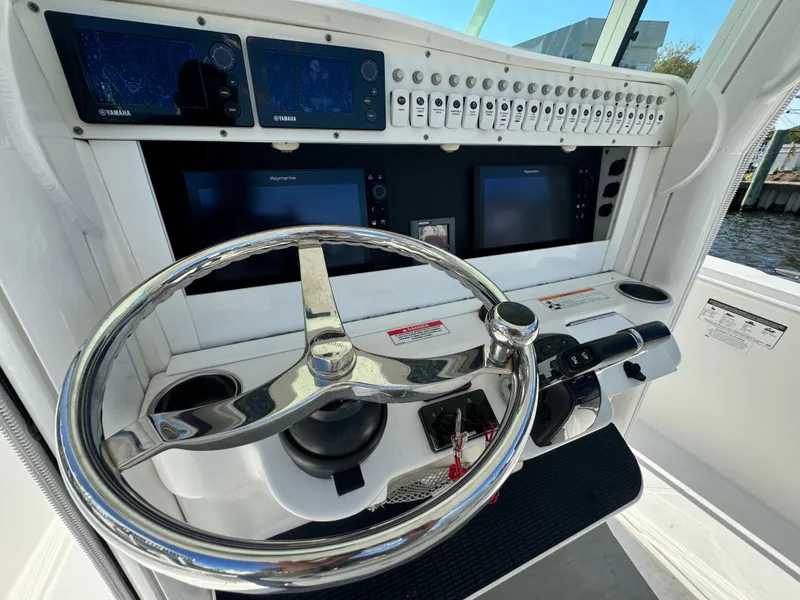 Slide: The Image of 2011 Everglades 325 Center Console helm with advanced navigation and control systems. - 12