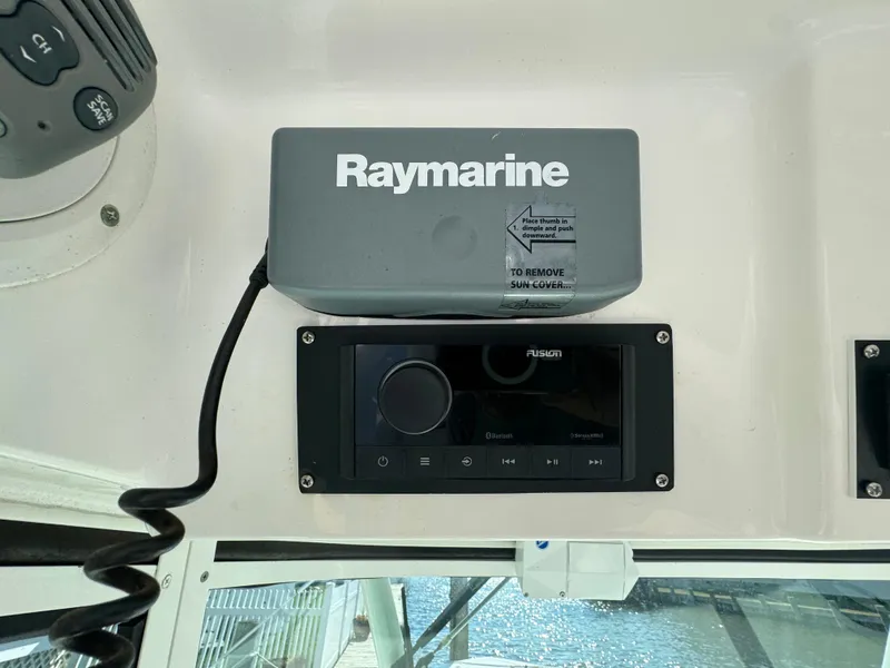 Slide: The Image of Raymarine and Fusion equipment on 2011 Everglades 325 Center Console boat dashboard. - 15